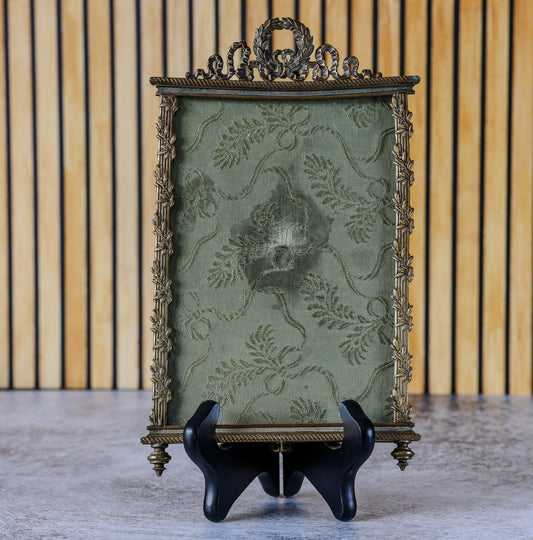 Antique French Louis XVI Style Gilt Bronze Photo Frame with Laurel Wreath and Ribbon Crest, Rope-Twist Border and Green Damask Mount, c. 1880–1900